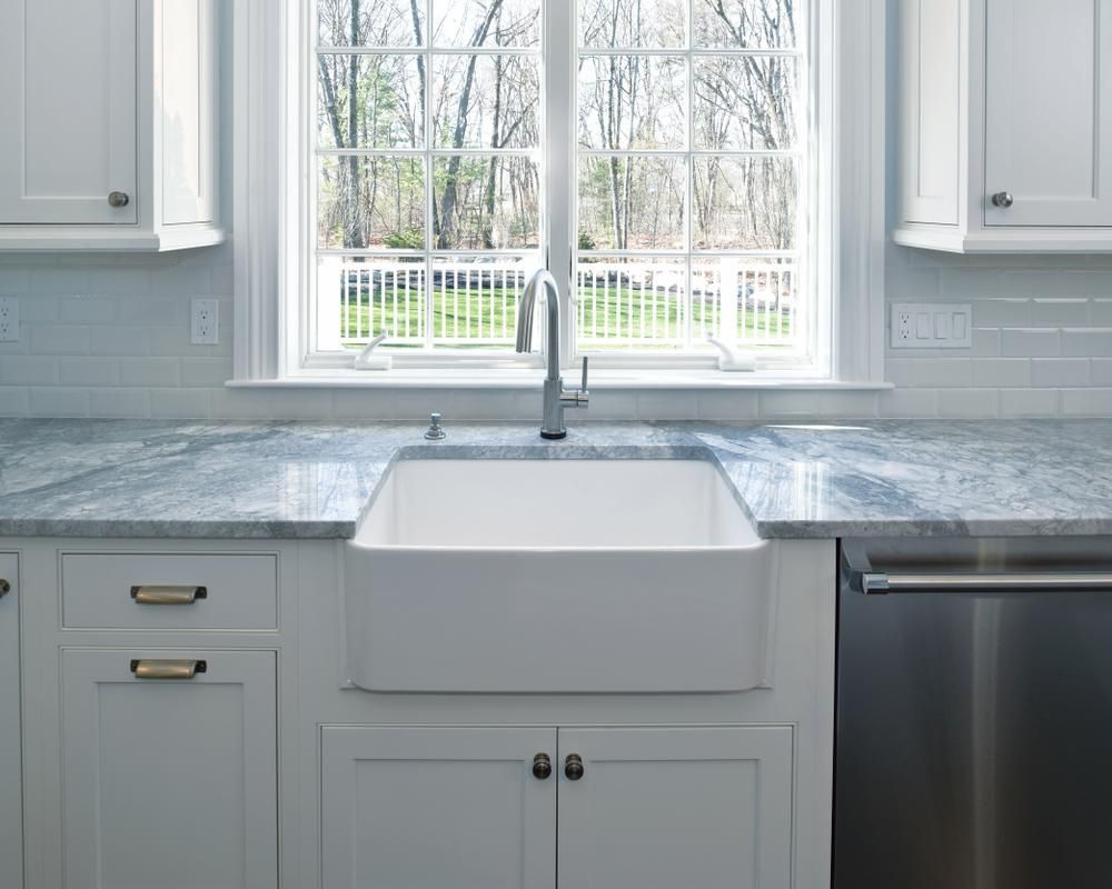 Farm style kitchen with porcelain apron-front sink.