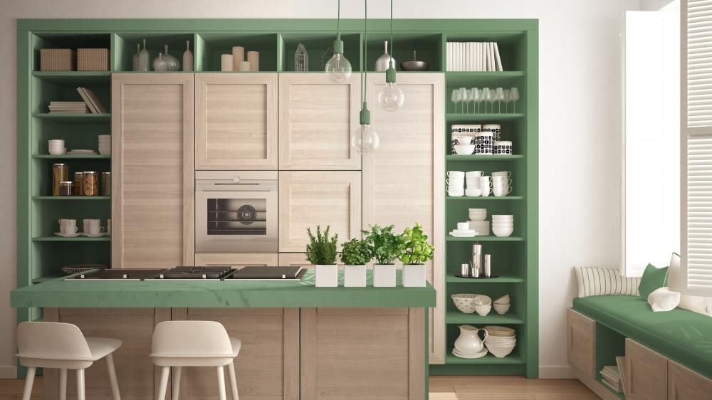 A farmhouse style kitchen remodel design with natural bamboo wood cabinets and green natural stone countertops.