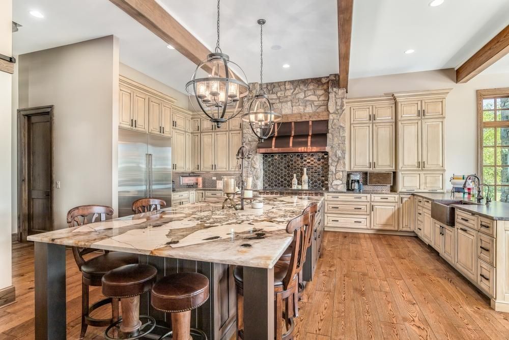 Farmhouse style kitchen remodel using natural stone materials. View 3 of 3.