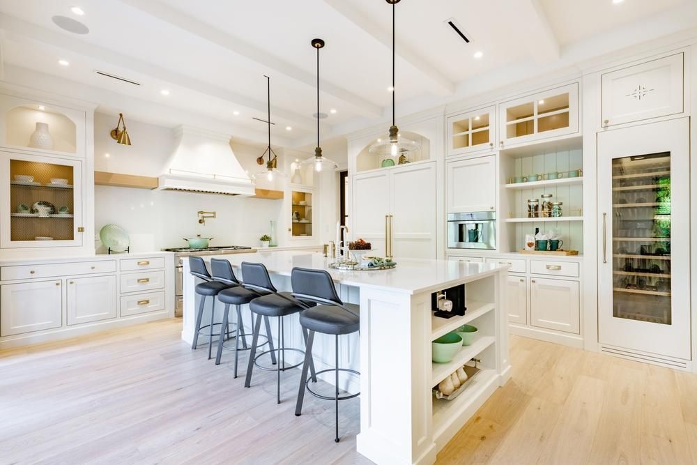 Farmhouse style kitchen island with open shelving and seating.