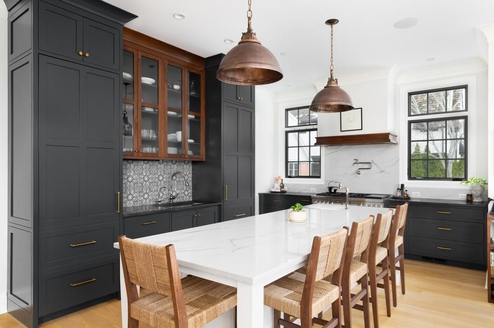 Farmhouse style kitchen remodel with grey painted solid wood cabinets.