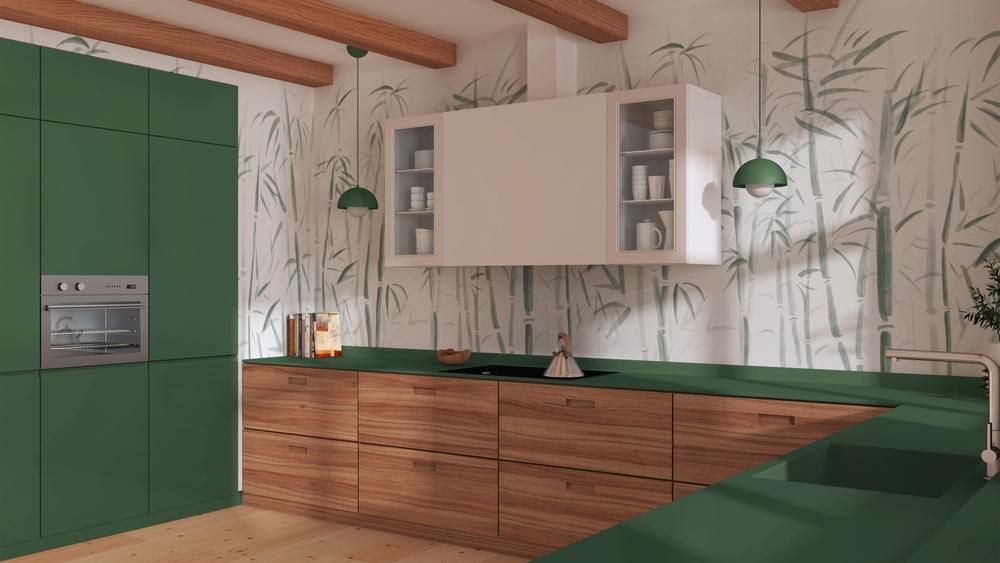 Mid-Century style kitchen remodel with olive green painted wood cabinets, countertops and bamboo print wallpaper.