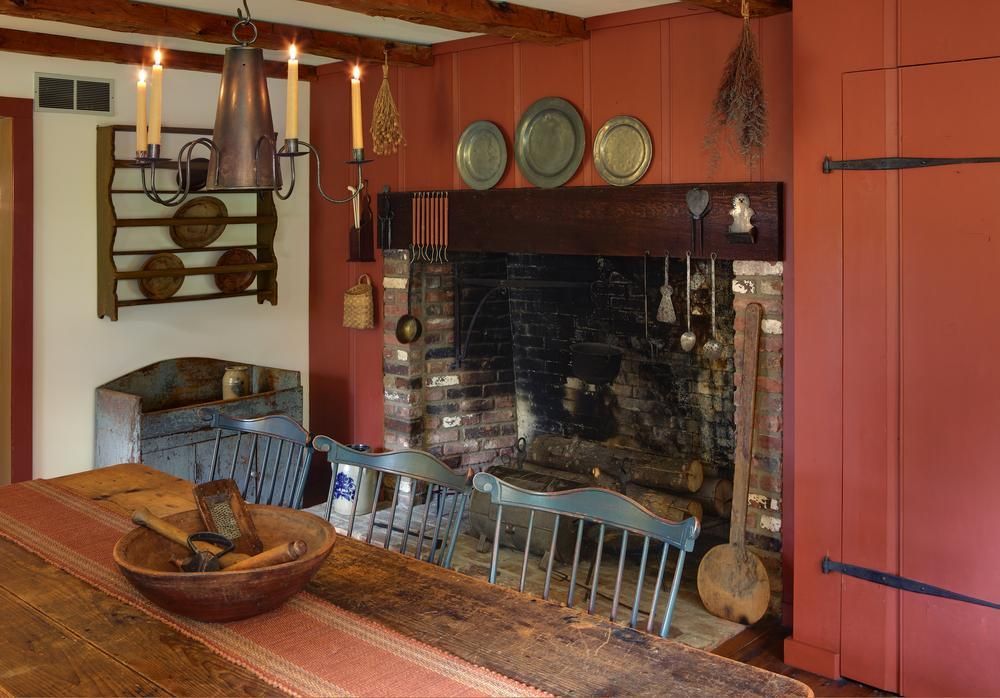 Custom farm style sliplap reclaimed wood cabinets painted red.