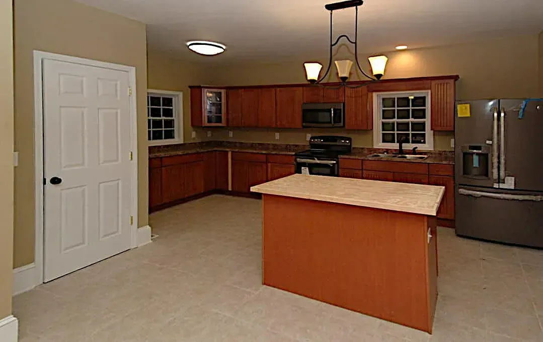 A kitchen with a large island in the middle of it