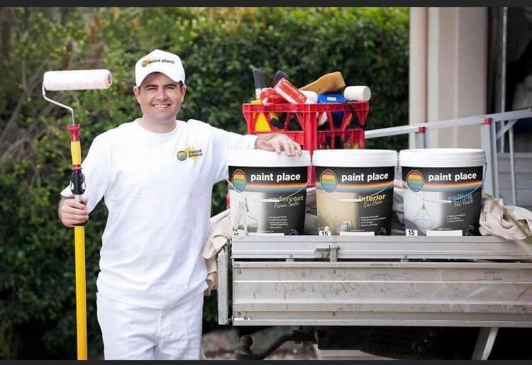 Man Holding Paintbrush With Three Interior Paint On The Truck — Paint Place Cowra In Forbes NSW