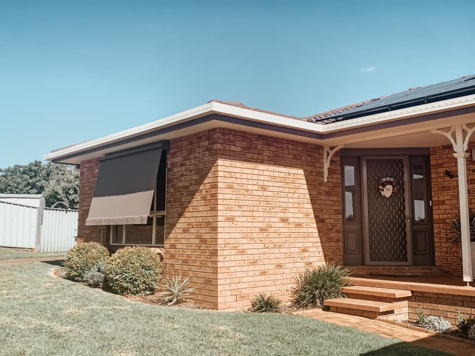Window Awning Installed On The Brick Wall Awning — Paint Place Cowra In Cowra NSW