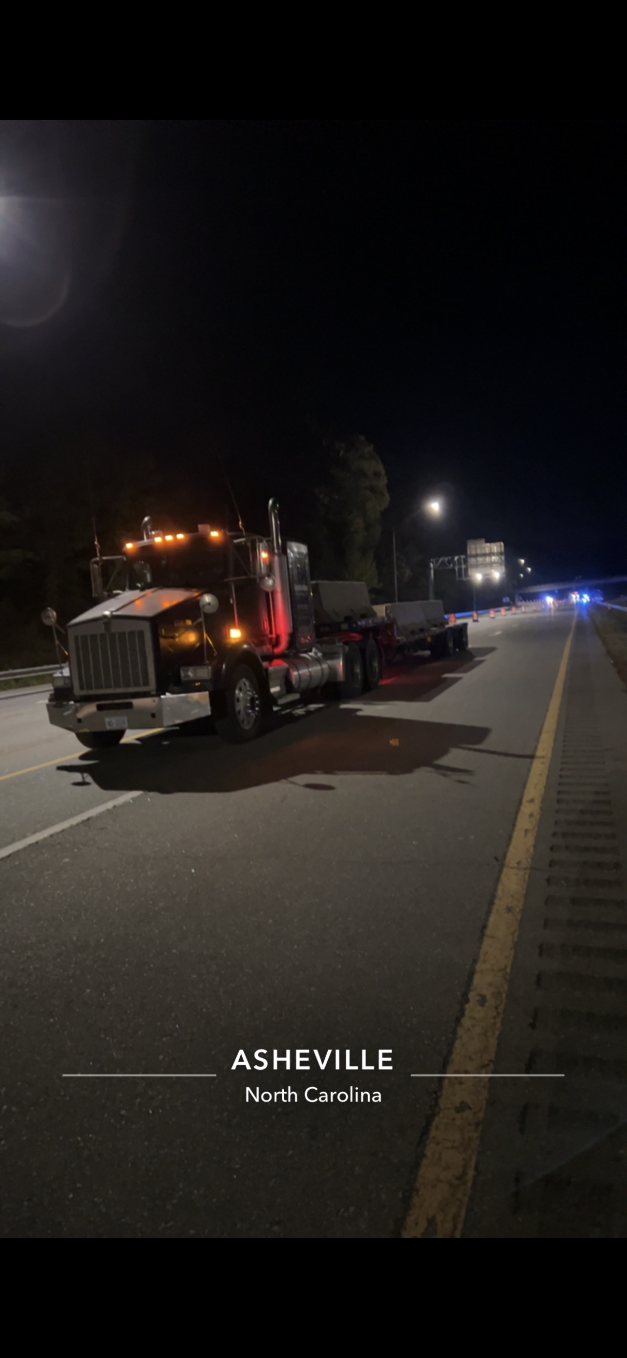Tow Truck is Driving Down a Highway at Night | Weaverville, NC | Appalachian Trucking LLC