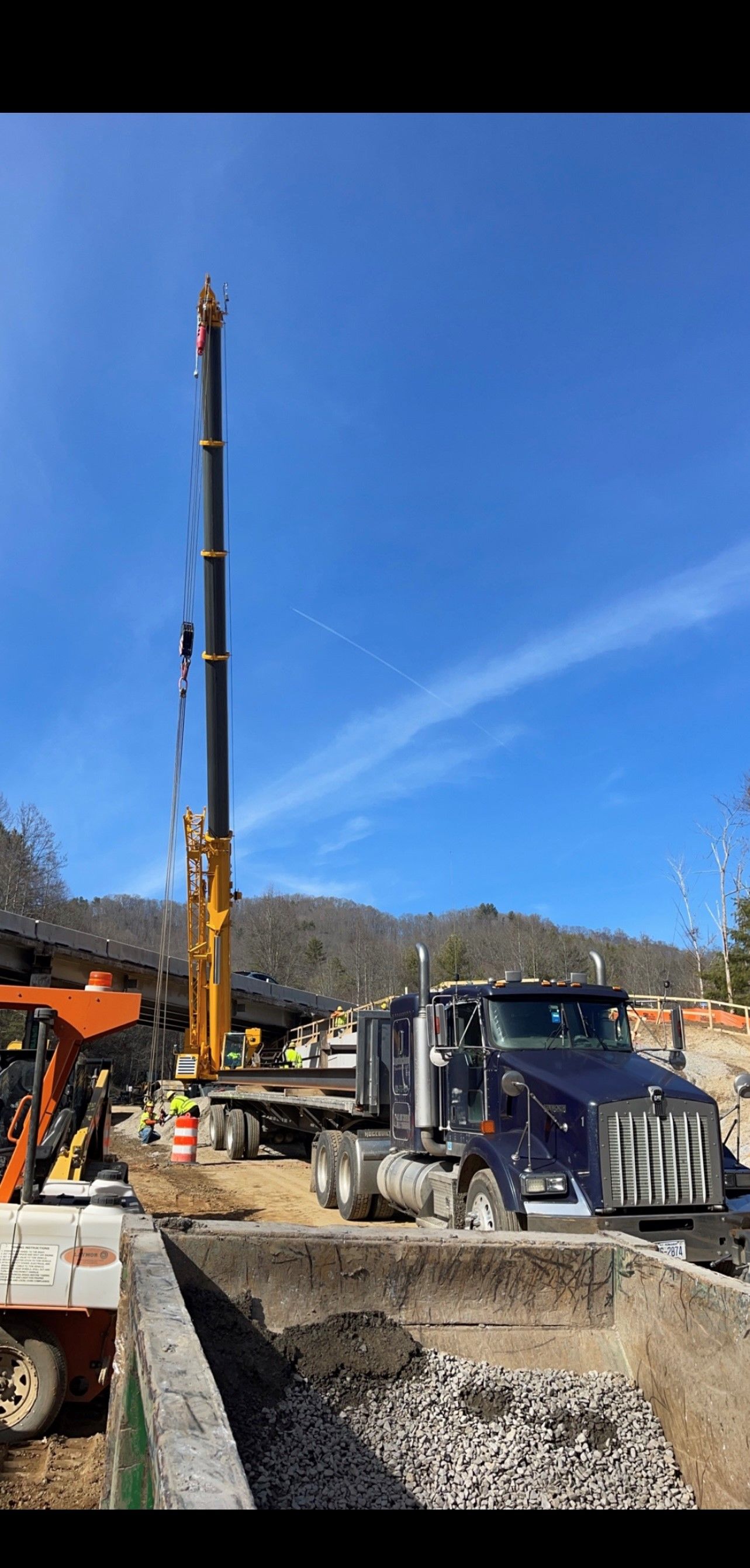 A Truck With a Crane on Top of It is Parked on a Construction Site | Weaverville, NC | Appalachian Trucking LLC