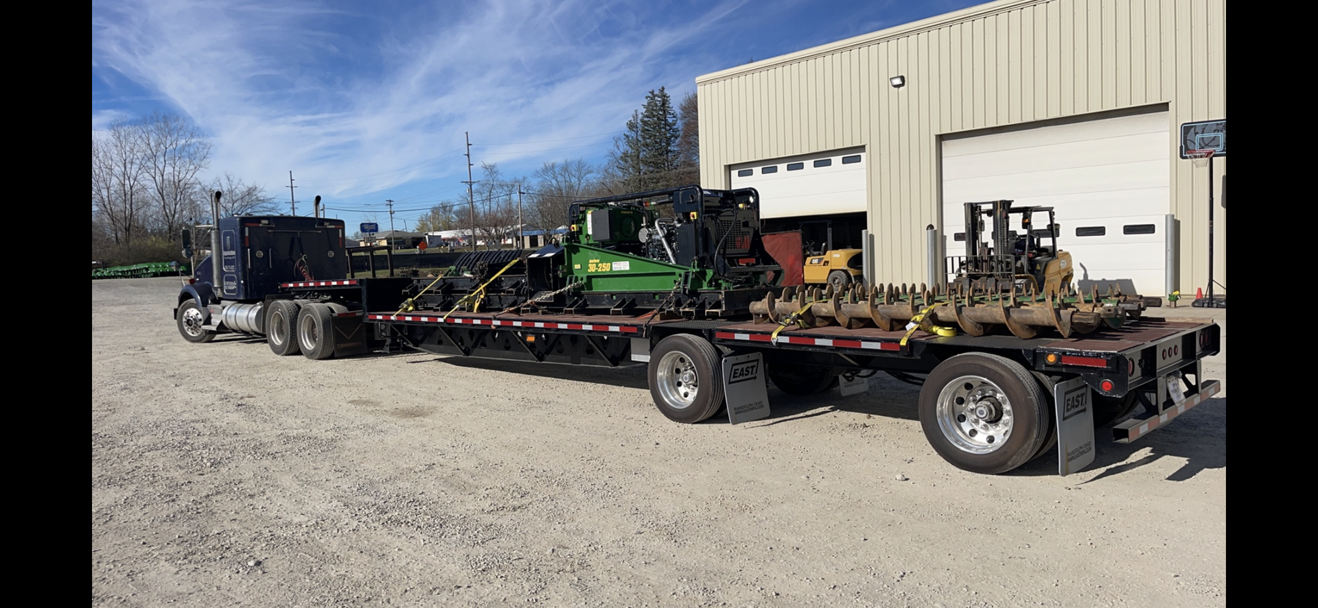 A Semi Truck is Carrying a Trailer Full of Machinery | Weaverville, NC | Appalachian Trucking LLC