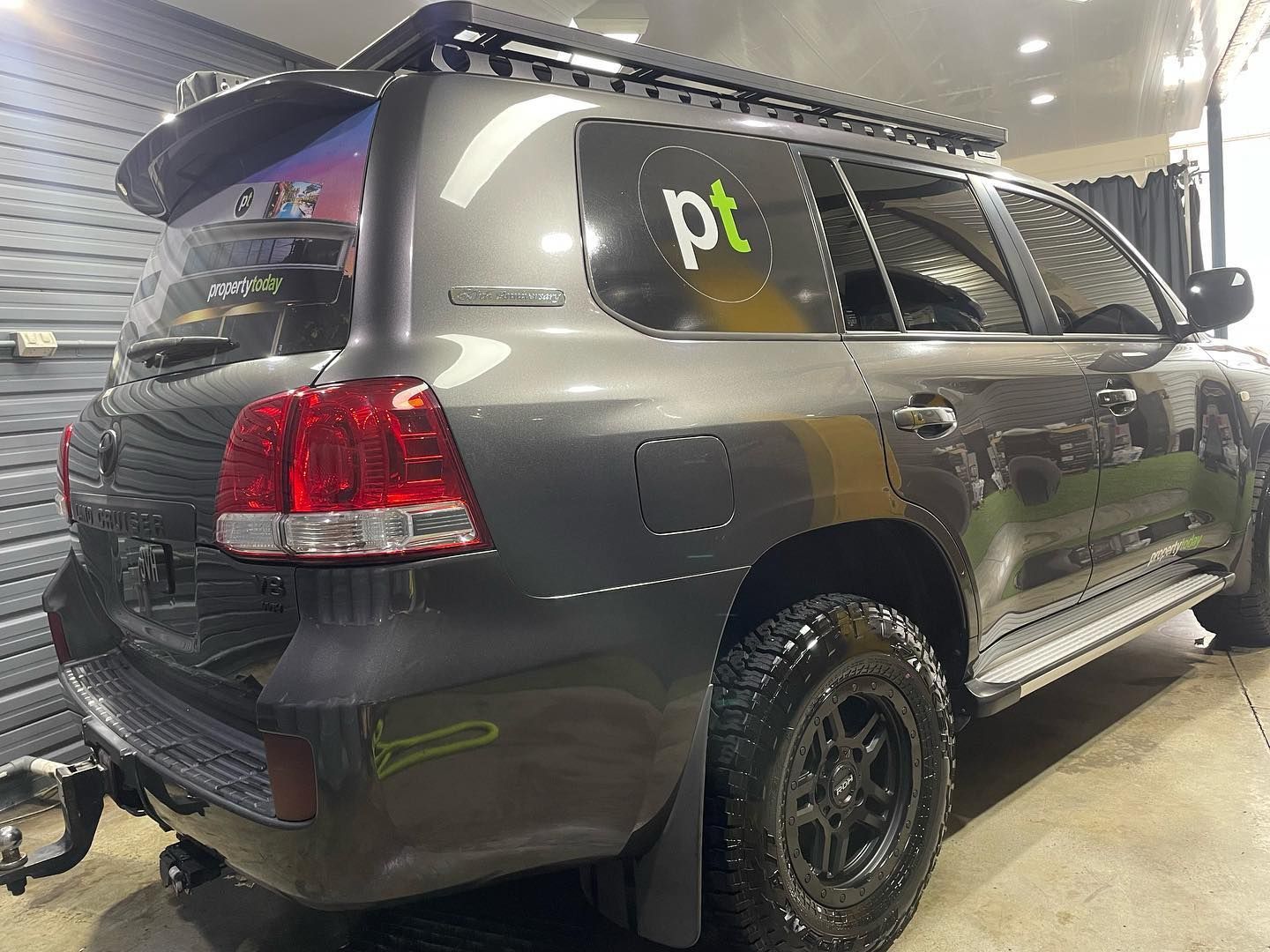 A Toyota Land Cruiser is Parked in a Garage - Maroochydore, QLD - Top Coat Auto Detailing