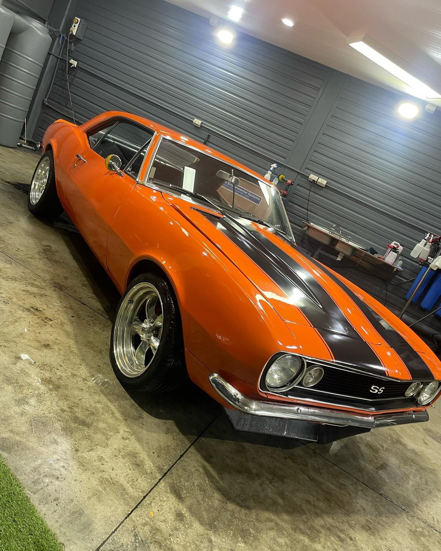 An Orange Car with Black Stripes is Parked in a Garage - Maroochydore, QLD - Top Coat Auto Detailing