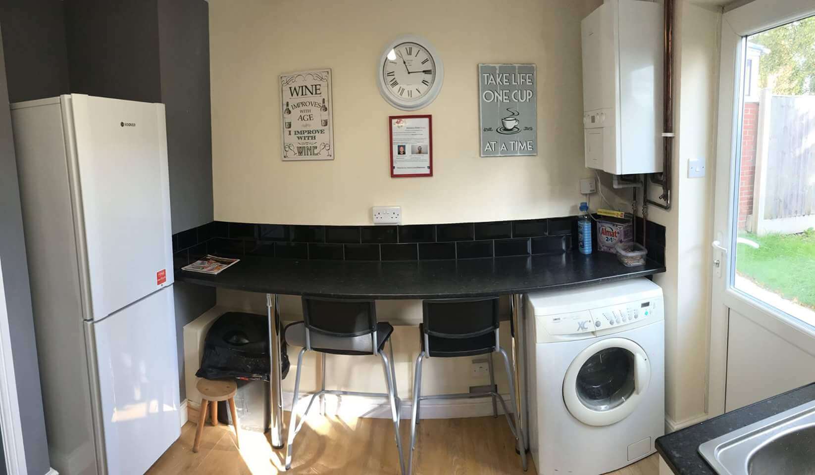 kitchen with clock on the wall