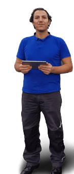 A guy standing having tab in his hands wearing blue T shirt