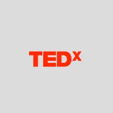Red "TEDx" logo on a gray background.