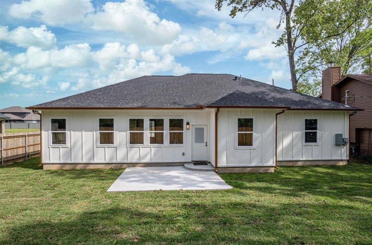 A man is standing on the side of a road.