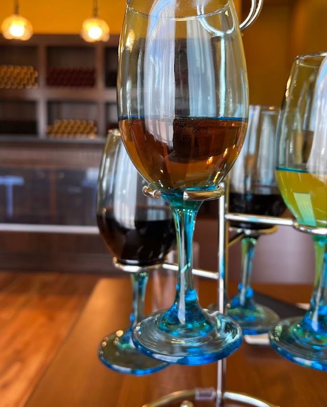 A bunch of wine glasses sitting on top of a table