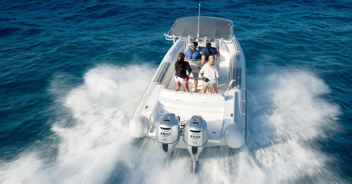 Two Outboard Motors Are Sitting In The Water Near A Dock — HiTune Marine In Bentley Park, QLD