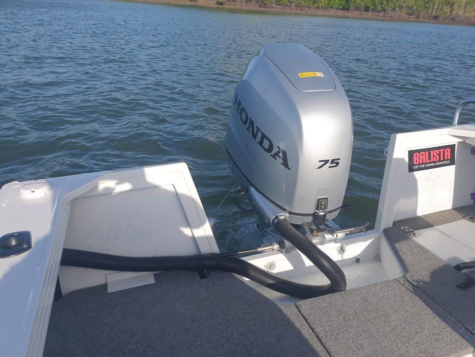 A Honda Outboard Motor Is Attached To The Back Of A Boat — HiTune Marine In Bentley Park, QLD