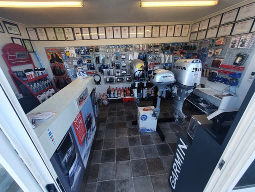 HiTune Marine Mechanic With Outboard Engine — Outboard Spare Parts In Cairns, QLD