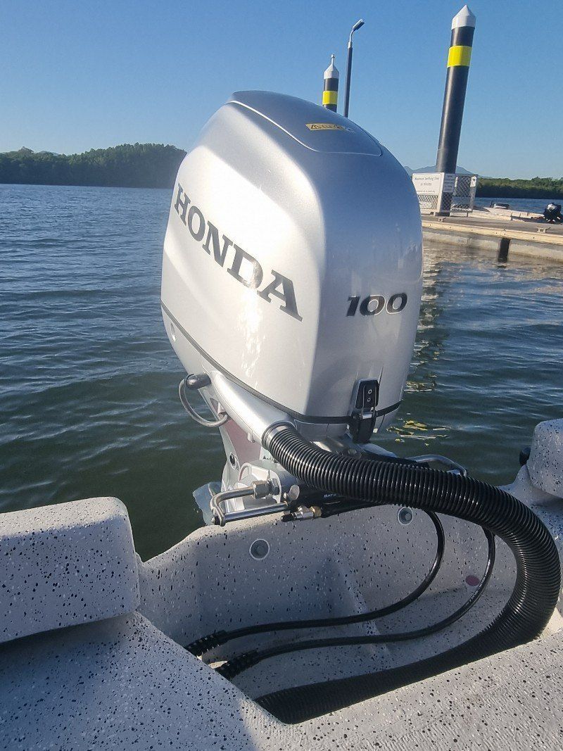 A Honda Outboard Motor is Attached to the Side of a Boat — HiTune Marine In Bentley Park, QLD