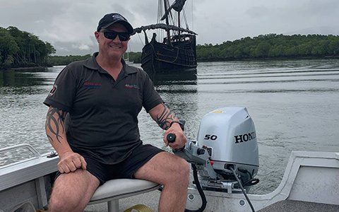 HiTune Marine Mechanic Using BF50 Outboard Engine — Gallery In Cairns, QLD