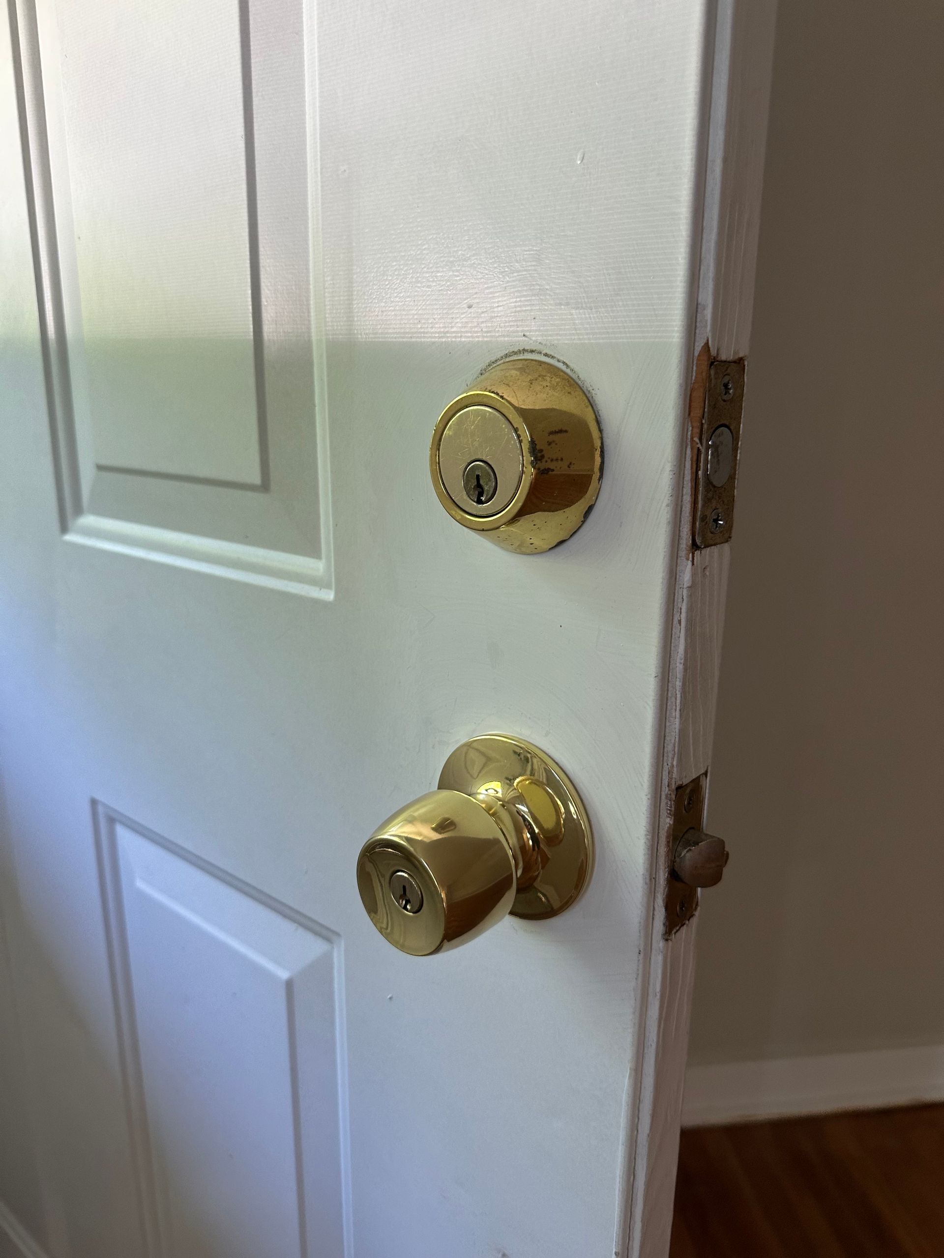 a brass doorknob and deadbolt