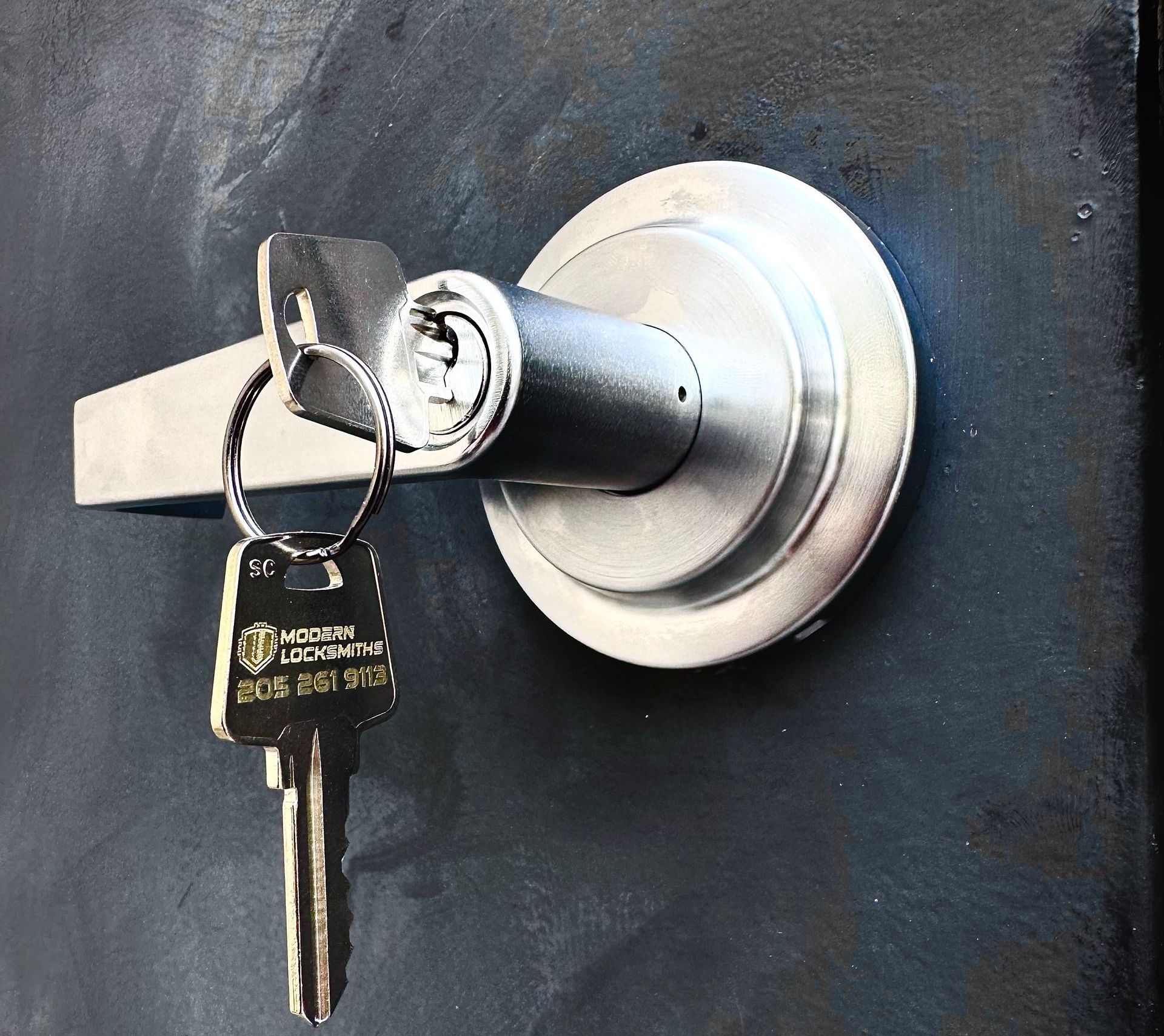 a lock with a set of keys dangling from the keyway