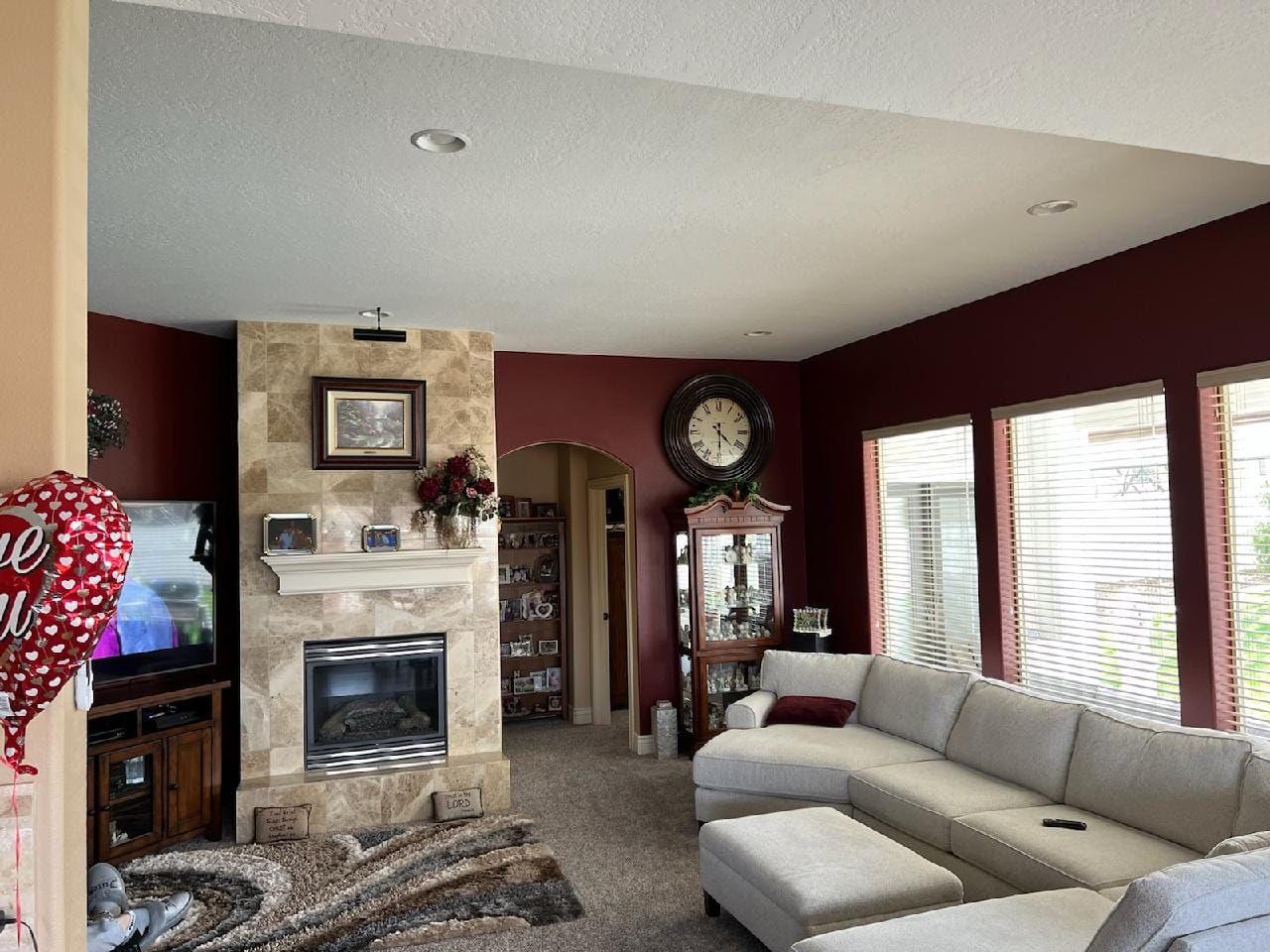 A living room with a fireplace and a couch