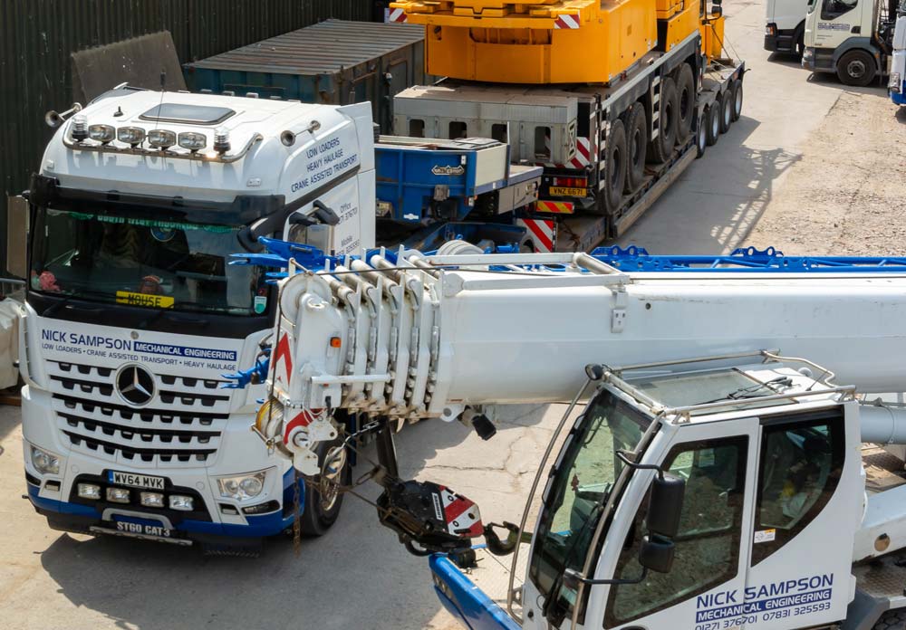 A large lorry transporting a  crane 