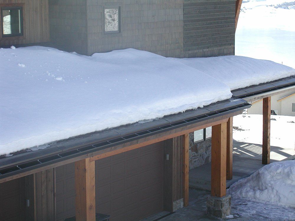 Melting snow from gutter heat tape | Engineered Roof Deicing