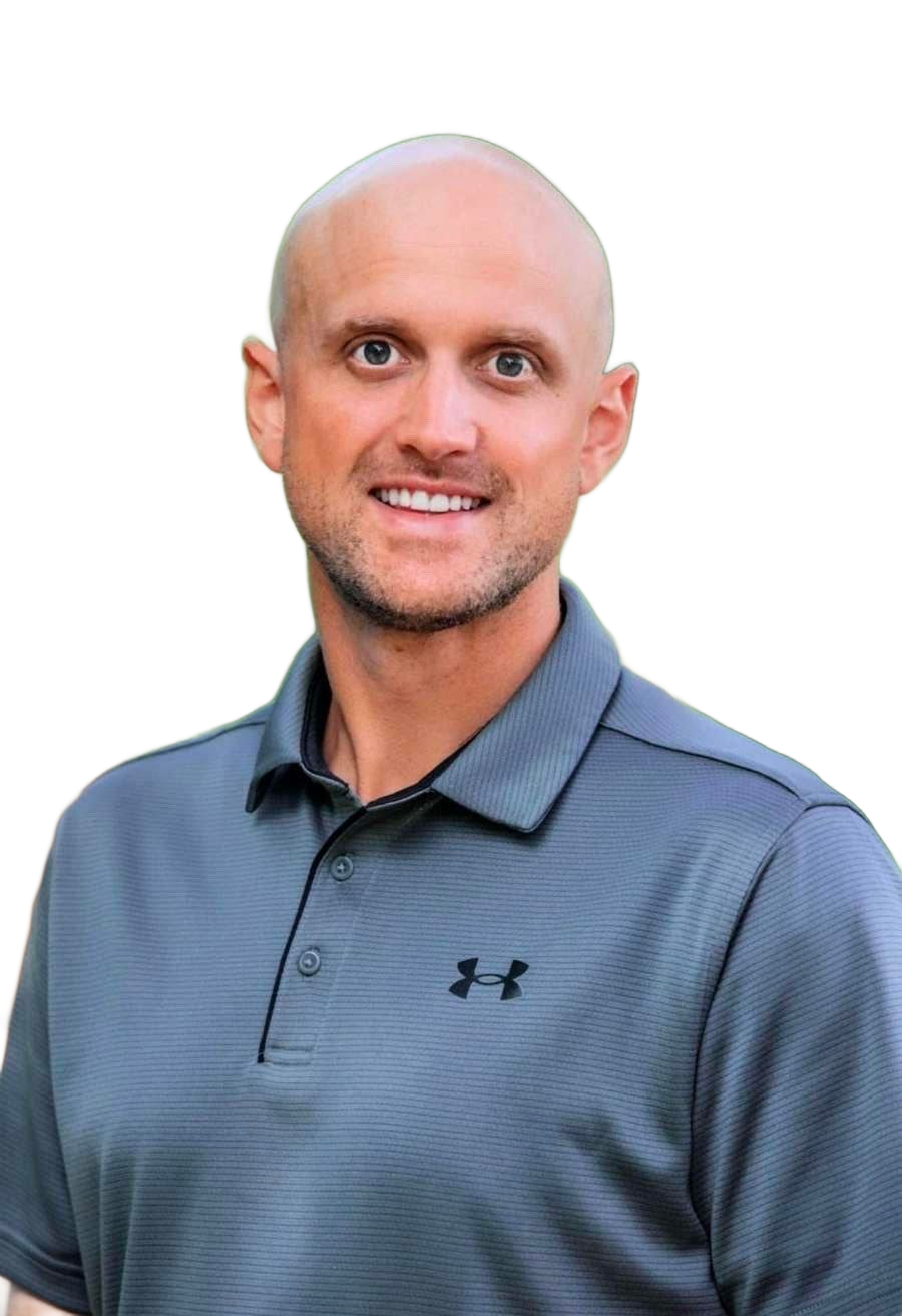 Bald man smiling, wearing gray Under Armour polo shirt, head and shoulders.