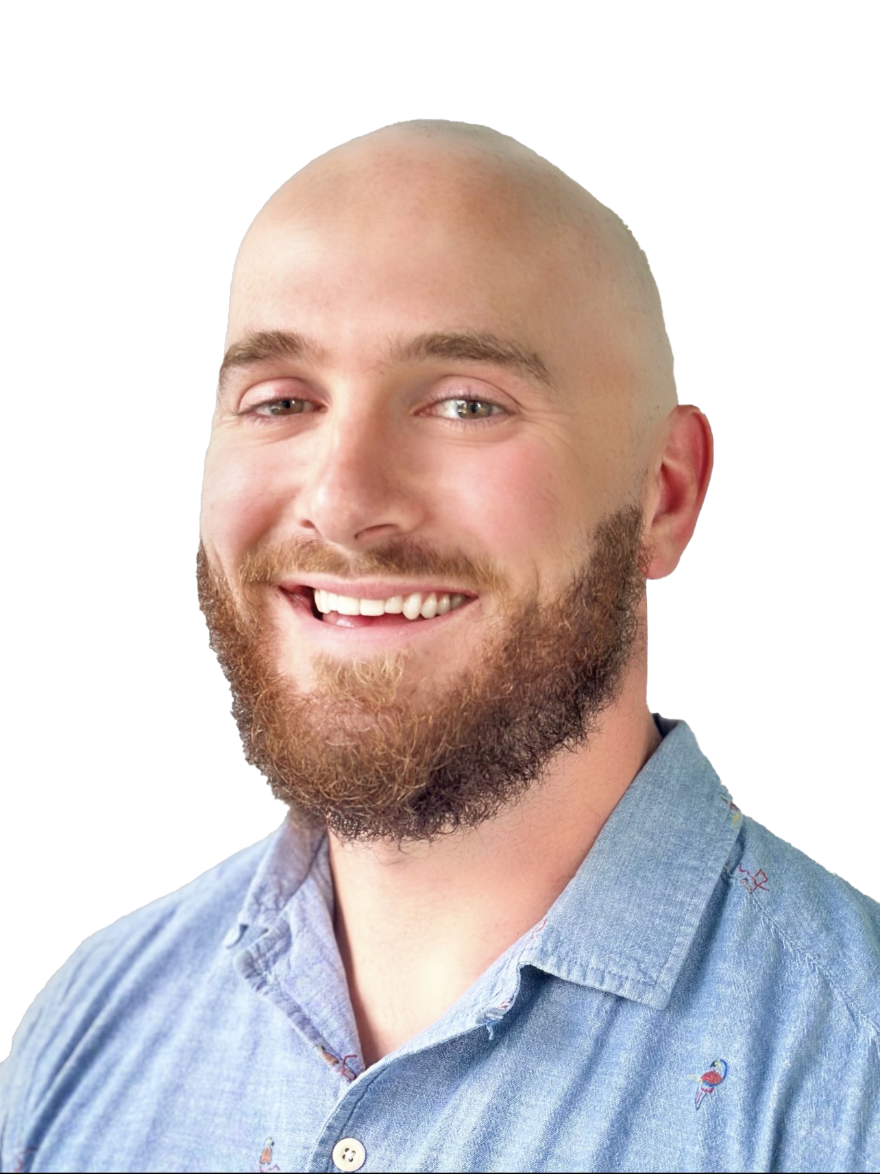 Bald man with a full beard, smiling in a blue button-down shirt.