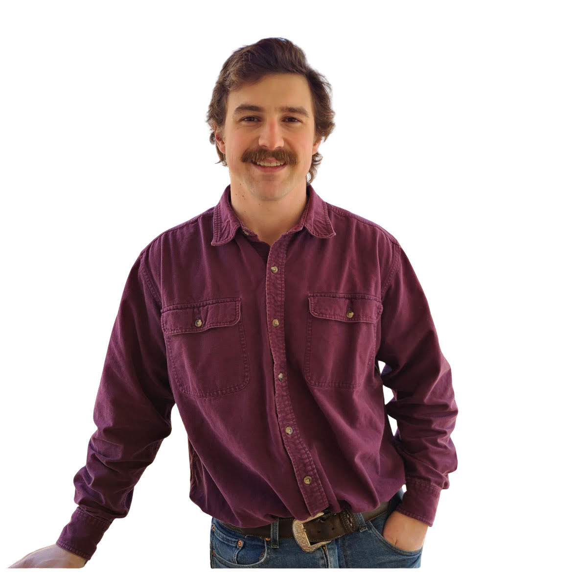 Bald man smiling, wearing gray Under Armour polo shirt, head and shoulders.