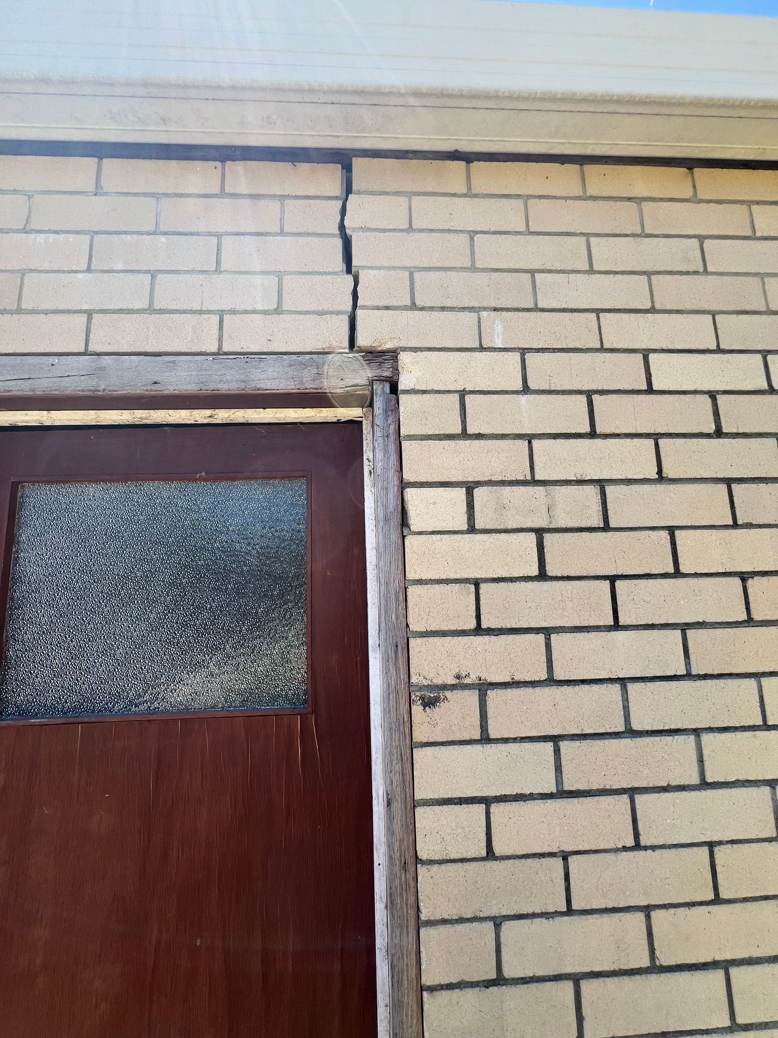 A structural wall crack above a door frame identified during a Perth building inspection.