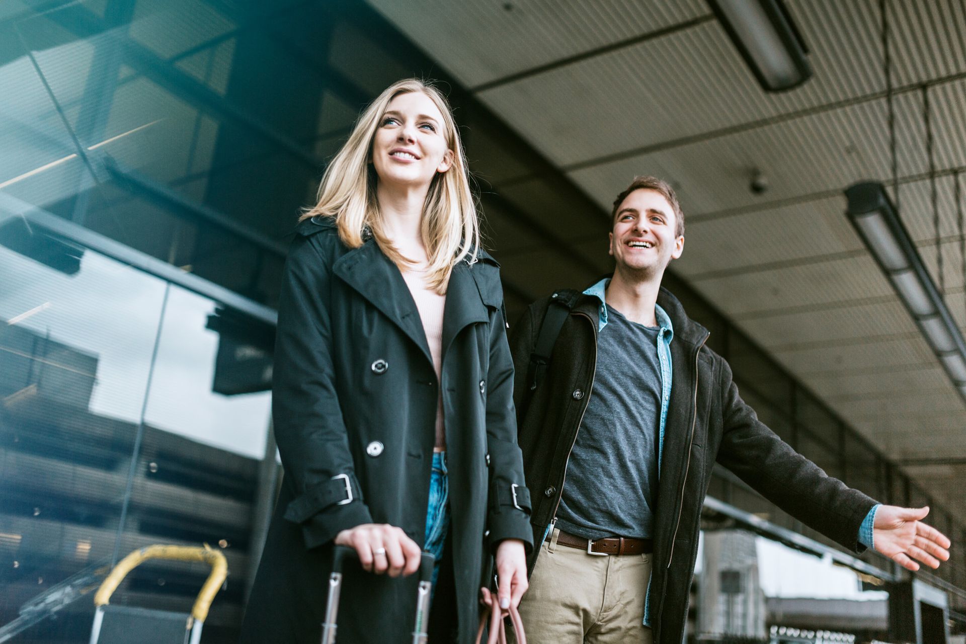 Young couple outside a train station
