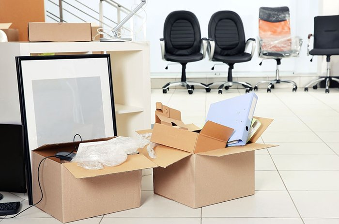 commercial space with boxes of supplies on the floor