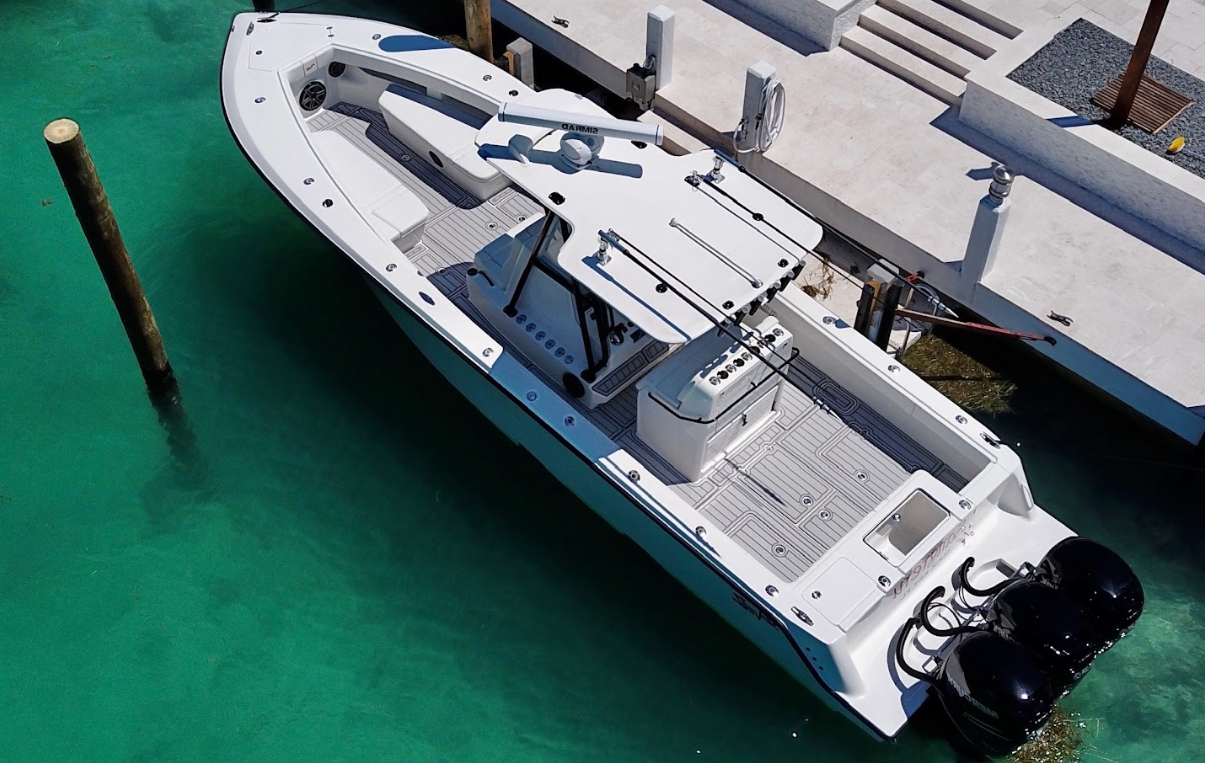 Boat flooring replacement featuring custom grey foam decking with precision CNC-cut lines