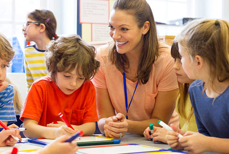 Australian Teacher happily teaching in Australian classroom