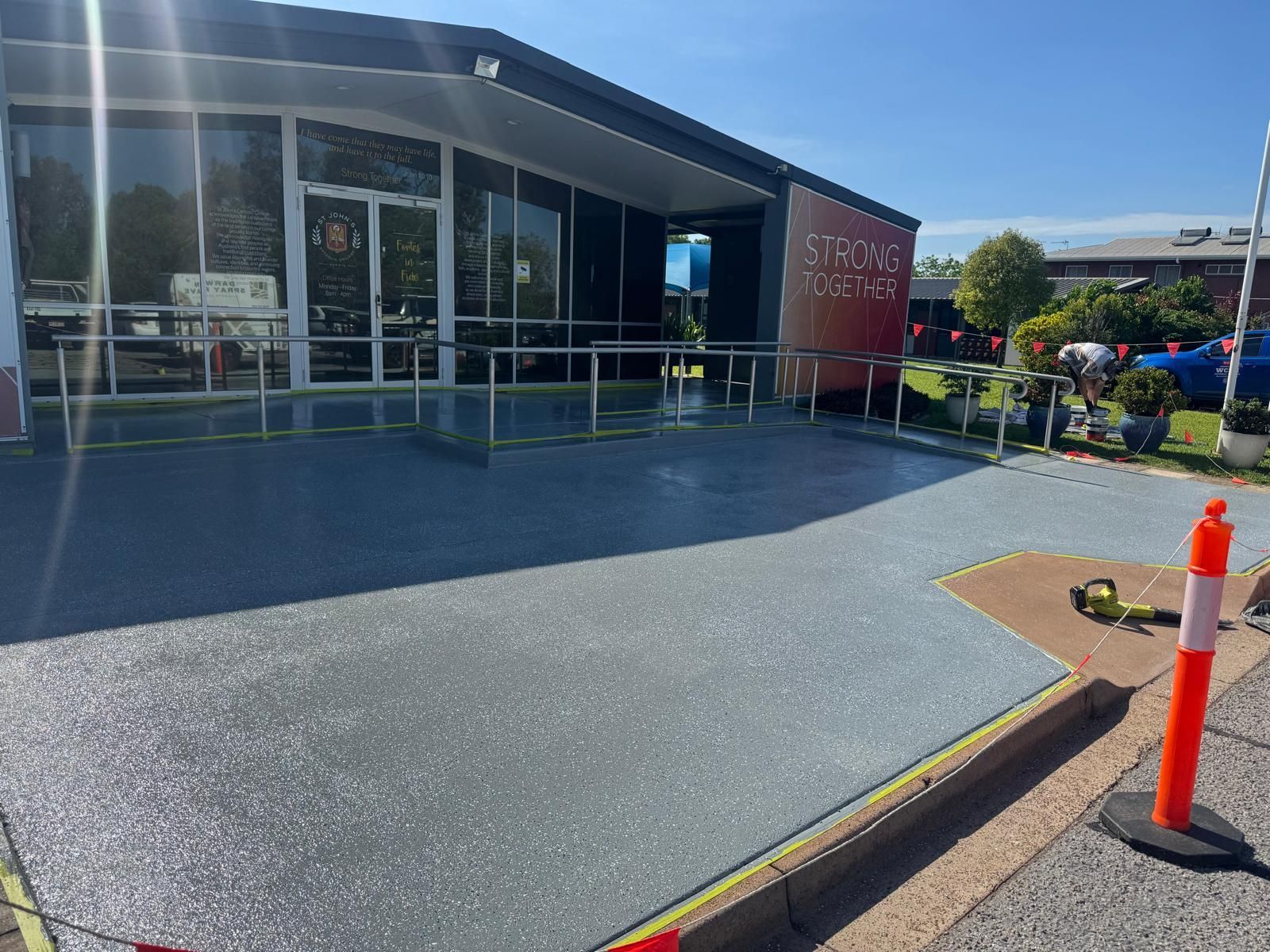dark grey epoxy floor outside a building walkway