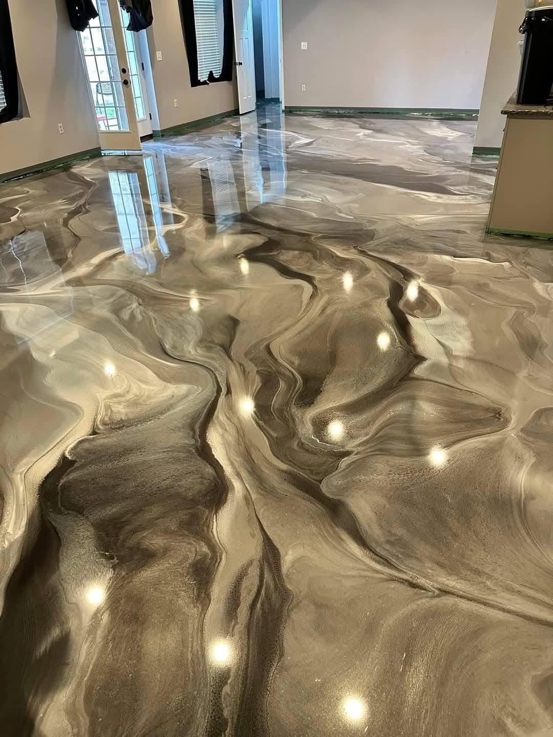 living area with black, white, and grey metallic epoxy floor