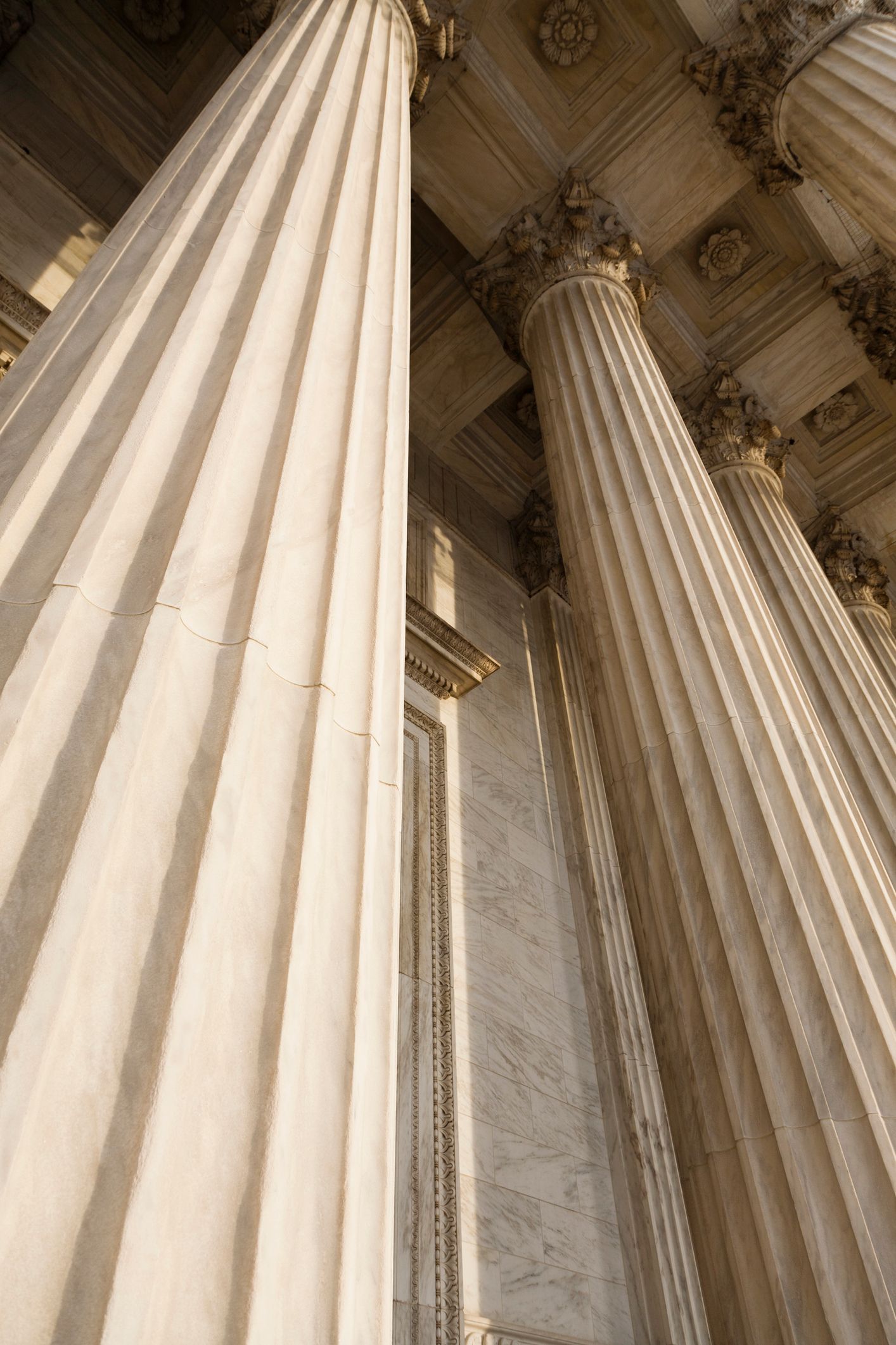 Looking up at the columns of a building
