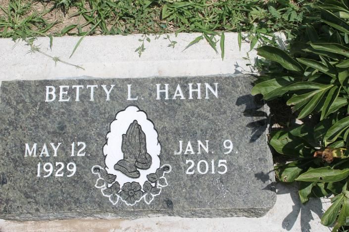 Gravestone for Betty L. Hahn with dates May 12, 1929 and Jan. 9, 2015, beside green plants