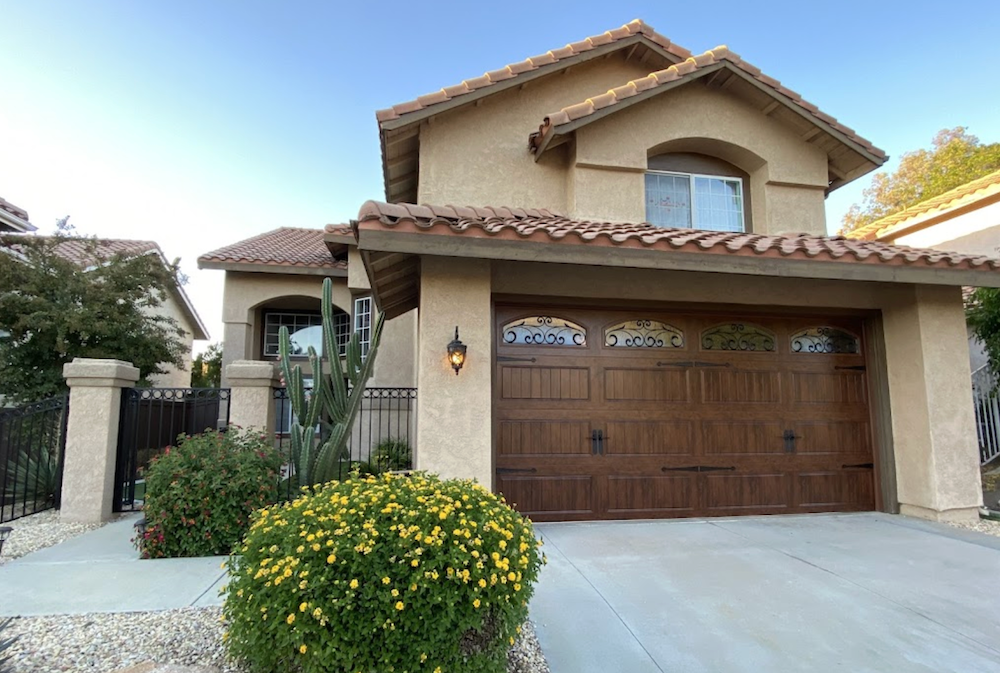A Large House with A Large Wooden Garage Door