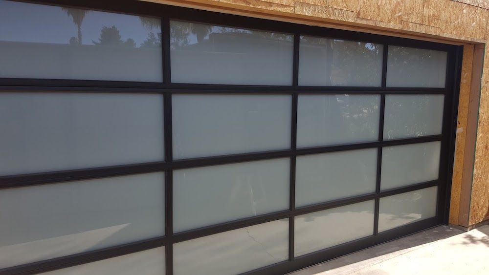 A Garage Door with A Lot of Windows and A Black Frame.