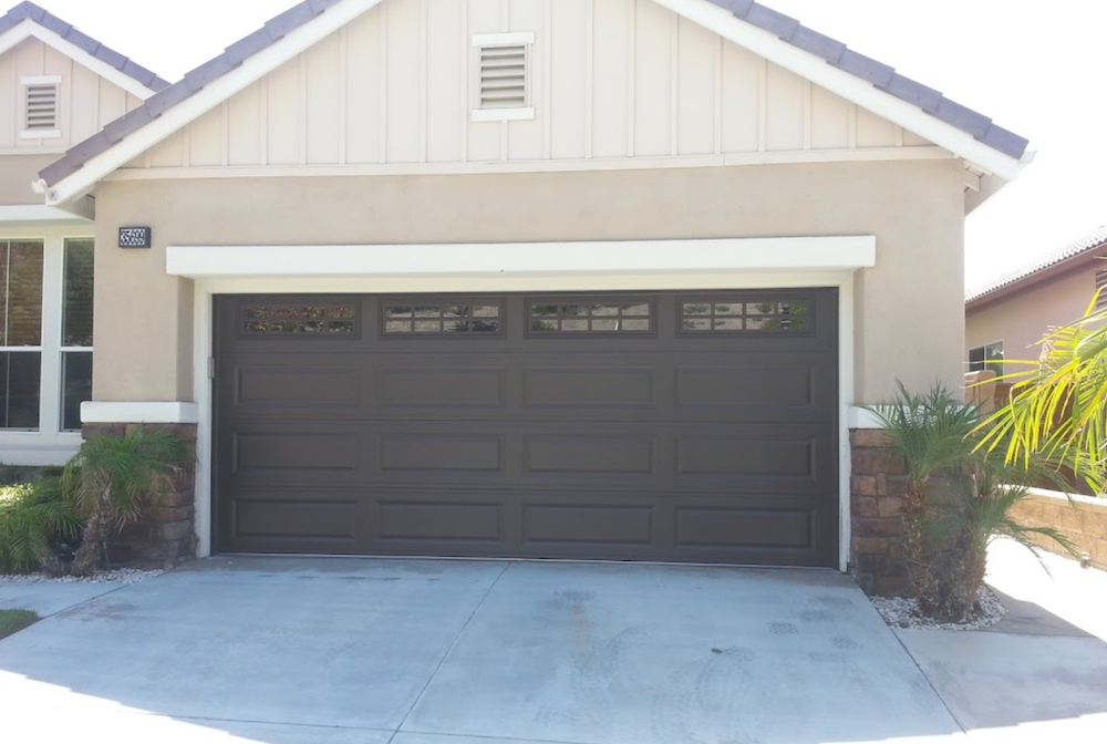 There Is a Large Garage Door in Front of A House.