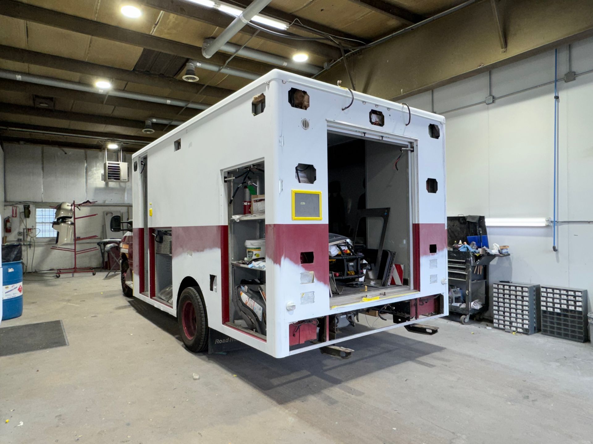 Fire rescue vehicle being serviced inside B&G Auto Body heavy-duty bay