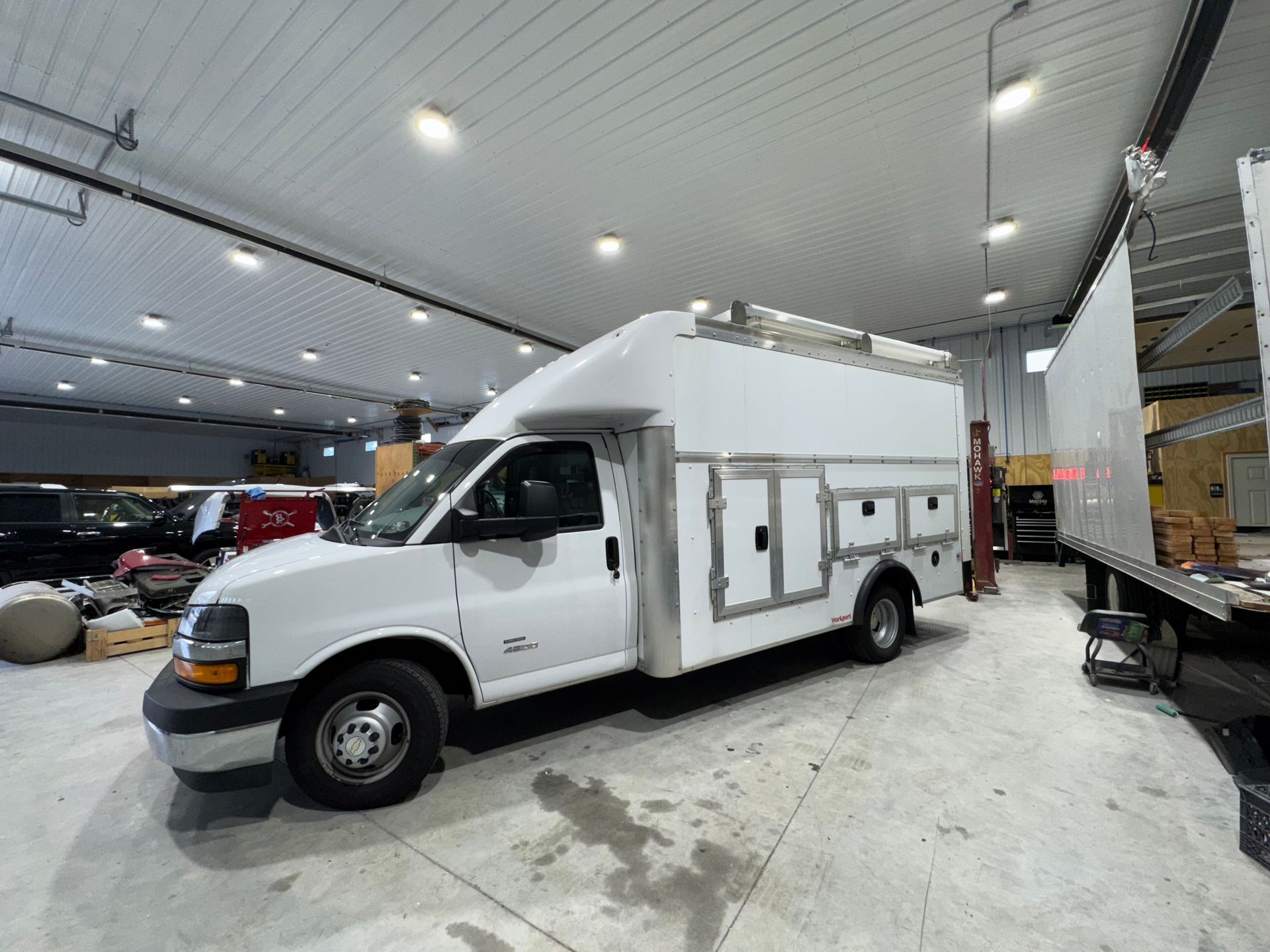 White utility truck undergoing heavy-duty collision repair at B&G Auto Body