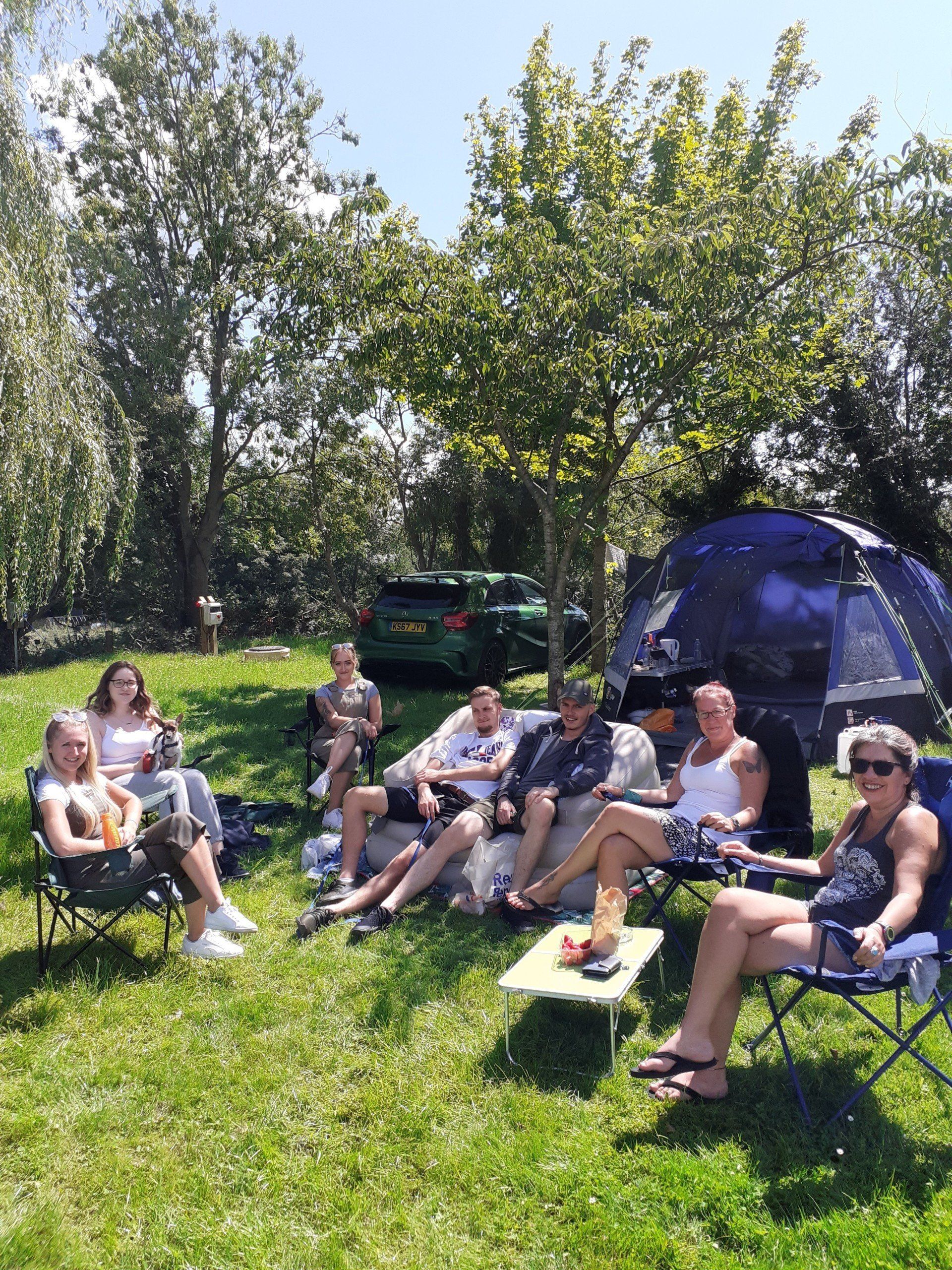 People having fun in cheddar caravan and campsite.