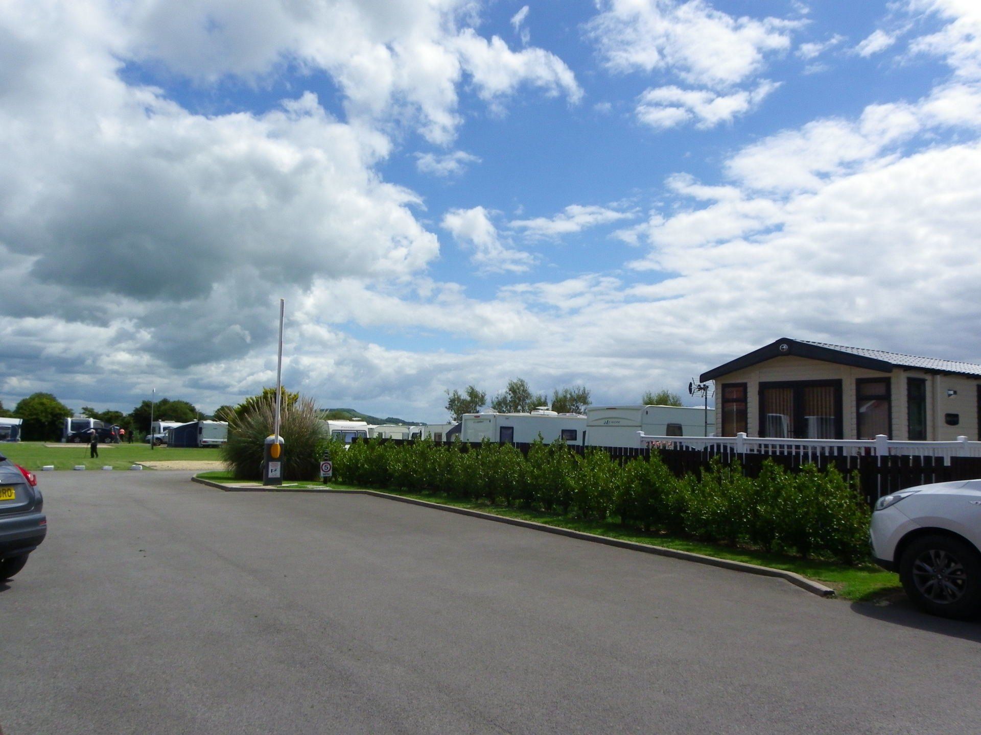 Caravans with awnings at Rose Farm Holiday Park.