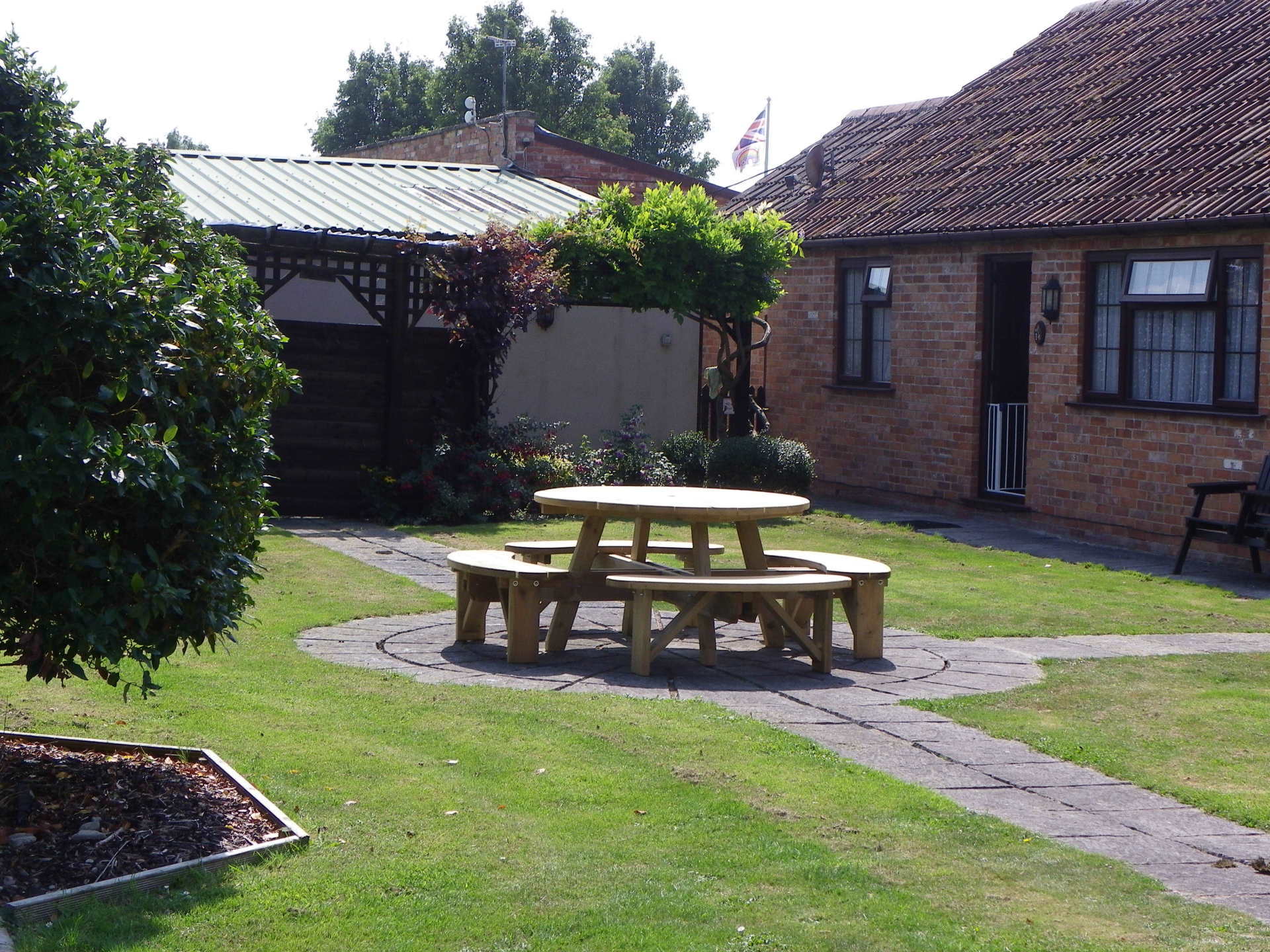 Outside seating area by the cottages.